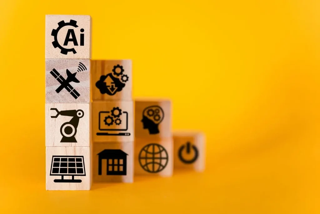 Blocs de bois empilés montrant des icônes technologiques symbolisant l'IA prédictive qui analyse les données existantes et l'IA générative qui crée du contenu neuf.